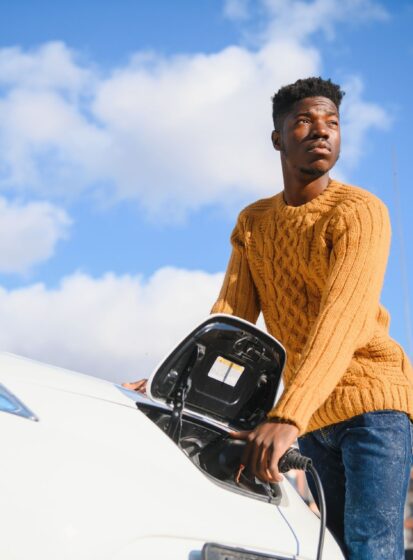 african-american-man-charging-his-electric-car-2023-11-27-04-56-10-utc.jpg